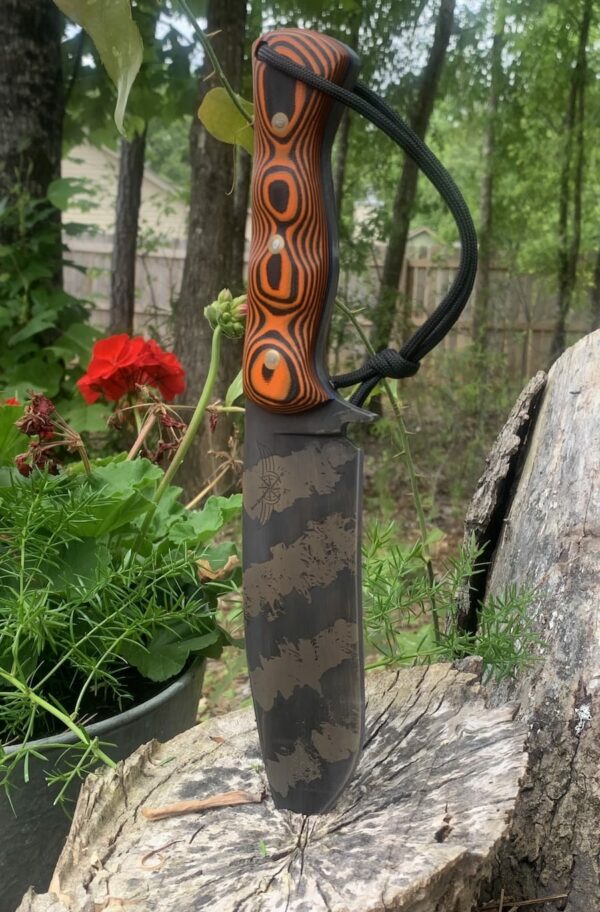 Journey Knifeworks 6-Inch Black/Orange Knife in Log